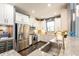 Modern kitchen with stainless steel appliances and granite countertops at 10338 Highland Park Pl, Palmetto, FL 34221