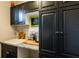 Kitchen area with dark cabinets and granite countertops at 10338 Highland Park Pl, Palmetto, FL 34221