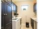 Spacious laundry room with washer, dryer, and ample storage at 10338 Highland Park Pl, Palmetto, FL 34221