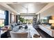 Bright living room featuring hardwood floors and a view of the lake at 10338 Highland Park Pl, Palmetto, FL 34221