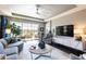 Living room with large sectional sofa and a view of the backyard at 10338 Highland Park Pl, Palmetto, FL 34221