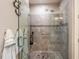 Walk-in shower with glass enclosure and tile surround at 10338 Highland Park Pl, Palmetto, FL 34221