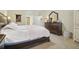 Bright bedroom with a king-size bed and built-in dresser at 1116 Hillandale Reserve Dr, Tampa, FL 33613