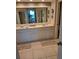 Double vanity bathroom with a large mirror at 1200 Country Club Dr # 1103, Largo, FL 33771