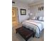 Spacious bedroom with a comfortable bed and a view of the bathroom at 1200 Country Club Dr # 1103, Largo, FL 33771