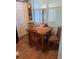Small dining area with wooden table and chairs at 1200 Country Club Dr # 1103, Largo, FL 33771