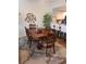 Elegant dining room with a wood table and chairs at 1200 Country Club Dr # 1103, Largo, FL 33771