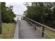 Wooden boardwalk leading to a waterfront view at 123 9Th St, Belleair Beach, FL 33786