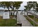 Wooden boardwalk with informational sign about local fish at 123 9Th St, Belleair Beach, FL 33786