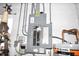 Electrical panel and water heater in garage area at 123 9Th St, Belleair Beach, FL 33786
