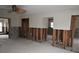Under construction living room with exposed framing and flooring at 123 9Th St, Belleair Beach, FL 33786