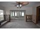 Under construction living room with exposed framing and flooring and view to sunroom at 123 9Th St, Belleair Beach, FL 33786