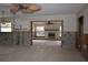 Under construction living room with exposed framing and flooring, fireplace at 123 9Th St, Belleair Beach, FL 33786