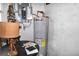 Mechanical room with water heater and electrical panel at 123 9Th St, Belleair Beach, FL 33786