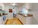 View of kitchen with granite counters and white cabinets at 14250 86Th Ter, Seminole, FL 33776