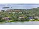 Aerial view of waterfront homes and lush greenery at 1571 Oceanview Dr, St Petersburg, FL 33715