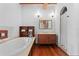 Main bathroom with soaking tub and walk-in shower at 1571 Oceanview Dr, St Petersburg, FL 33715