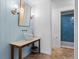 Modern bathroom with light blue walls and a white vessel sink at 1571 Oceanview Dr, St Petersburg, FL 33715