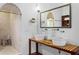 Bathroom features double vanities, marble countertops, and a walk-in shower at 1571 Oceanview Dr, St Petersburg, FL 33715