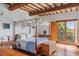Bedroom with canopy bed and access to balcony at 1571 Oceanview Dr, St Petersburg, FL 33715