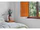 Bedroom with wood window shutters and view at 1571 Oceanview Dr, St Petersburg, FL 33715