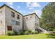 Stone exterior with lush landscaping, showcasing a charming architectural design at 1571 Oceanview Dr, St Petersburg, FL 33715