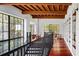 Elegant hallway with hardwood floors, high ceilings, and built-in shelving at 1571 Oceanview Dr, St Petersburg, FL 33715