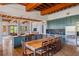 Gourmet kitchen boasts wood beams, custom cabinetry, and an island at 1571 Oceanview Dr, St Petersburg, FL 33715