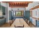 Eat-in kitchen with wood beams, custom cabinetry, and water views at 1571 Oceanview Dr, St Petersburg, FL 33715