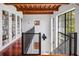 Library with built-in shelves and hardwood floors at 1571 Oceanview Dr, St Petersburg, FL 33715