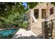 Stone house exterior with pool and stairs at 1571 Oceanview Dr, St Petersburg, FL 33715
