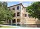 Stone house exterior with pool and landscaping at 1571 Oceanview Dr, St Petersburg, FL 33715