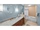 Updated bathroom features a granite vanity, tiled shower and tub at 175 2Nd S St # 1108, St Petersburg, FL 33701