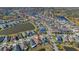 Aerial view of houses and lake in a residential area at 17671 Bright Wheat Dr, Lithia, FL 33547