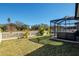 Spacious backyard with hot tub and screened enclosure at 17671 Bright Wheat Dr, Lithia, FL 33547