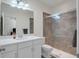 Clean bathroom with white vanity, shower, and toilet at 17671 Bright Wheat Dr, Lithia, FL 33547