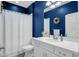 Bathroom with white vanity, toilet, and shower at 17671 Bright Wheat Dr, Lithia, FL 33547