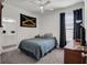Bright bedroom with double bed, window, and ensuite bathroom access at 17671 Bright Wheat Dr, Lithia, FL 33547