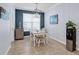 Breakfast nook with white table and chairs, near kitchen at 17671 Bright Wheat Dr, Lithia, FL 33547