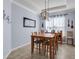 Dining room with light walls, wood table, and chandelier at 17671 Bright Wheat Dr, Lithia, FL 33547