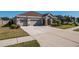 Two-story home with attached three-car garage at 17671 Bright Wheat Dr, Lithia, FL 33547