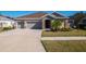 Two-story home with attached three-car garage at 17671 Bright Wheat Dr, Lithia, FL 33547