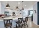 Modern kitchen with white cabinets and island at 17671 Bright Wheat Dr, Lithia, FL 33547