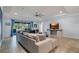 Open living space showcasing a comfortable sectional sofa and large TV at 17671 Bright Wheat Dr, Lithia, FL 33547