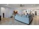 Spacious living area with sectional sofa, open floor plan, and kitchen views at 17671 Bright Wheat Dr, Lithia, FL 33547