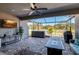 Relaxing patio with hot tub, fire pit, and TV at 17671 Bright Wheat Dr, Lithia, FL 33547