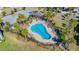 Community pool with lounge chairs and a pergola at 17671 Bright Wheat Dr, Lithia, FL 33547