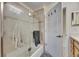 Updated bathroom with walk-in shower and linen closet at 2003 Captiva Ct, Sun City Center, FL 33573