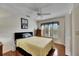 Comfortable bedroom featuring wood floors and ceiling fan at 2003 Captiva Ct, Sun City Center, FL 33573