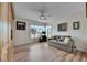 Den with wood built-ins, sofa, and plenty of natural light at 2003 Captiva Ct, Sun City Center, FL 33573